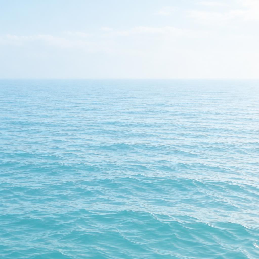 Pale-blue sea under soft light