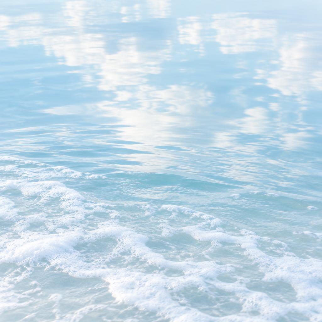 Wind rippling across sea foam
